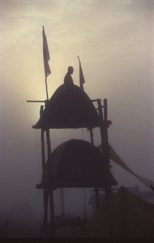 March 2003 Photo of the Month 11 Kbytes showing two tents and a Scout on a double decker tower silhouetted against a late evening sky. Two flags hang in the still air.